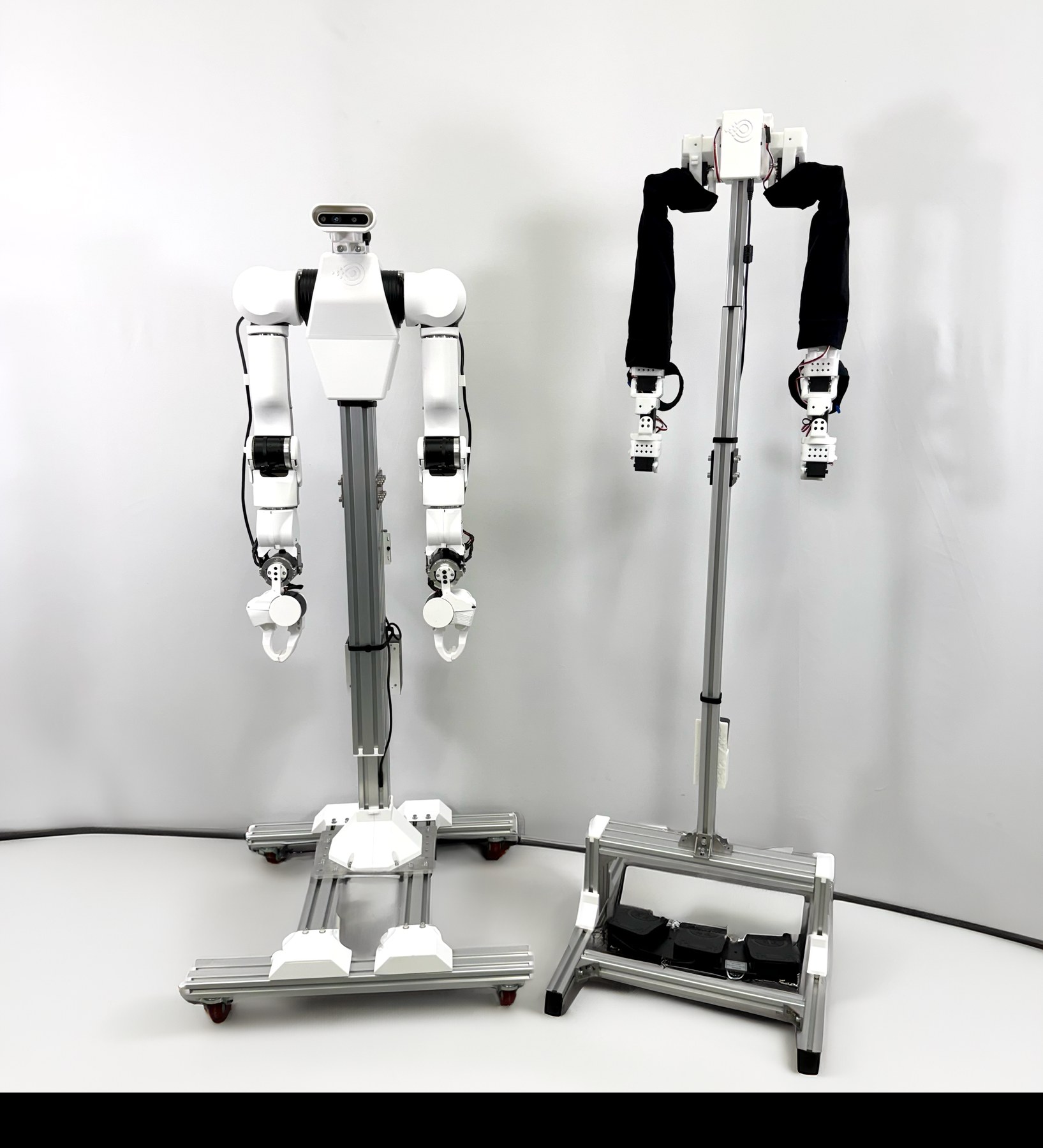 Yuri follower arms alongside the OpenLeader force-feedback leader arms